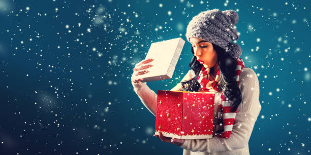 istock Happy young woman with Christmas present box 882405796