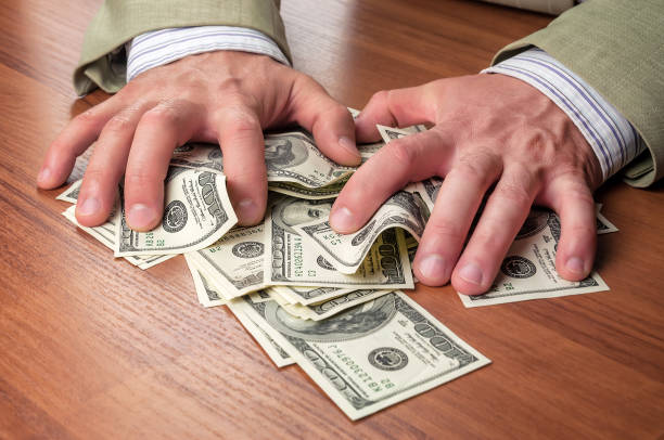 istock businesman, money, hands 882410950