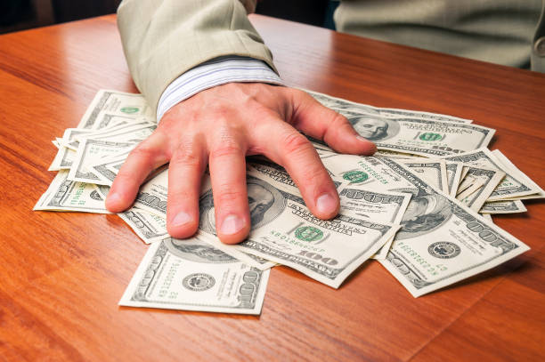istock businessman takes dollars 882410974