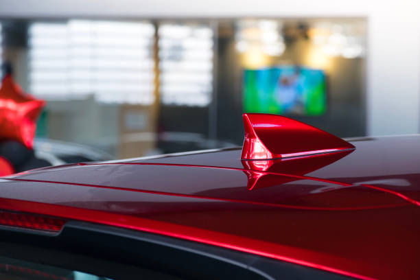 istock antenna shark fin white color on blurry backgorund. Using wallpaper or background.this car, automotive, transport image. 882414940