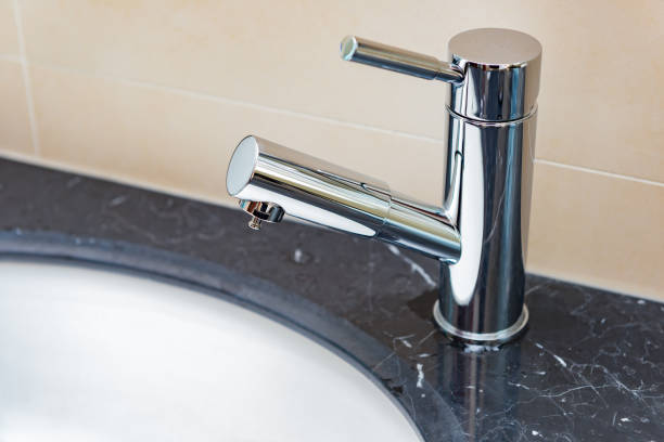 istock stainless steel water tap and washbasin 882424626