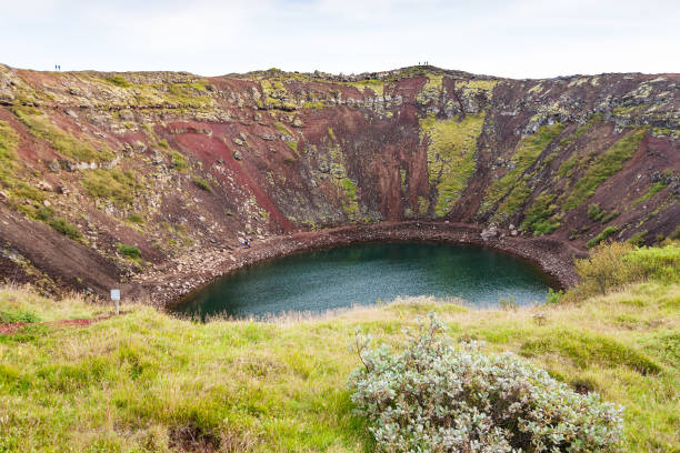istock old volcanic crater with Kerid lake in Iceland 882435908