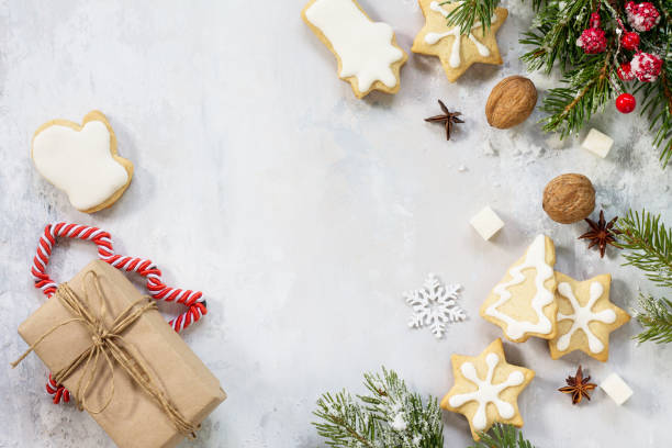 istock Christmas background frame or greeting xmas card. Gingerbread on a festive Christmas table. Flat lay, top view with copy space. 882439778