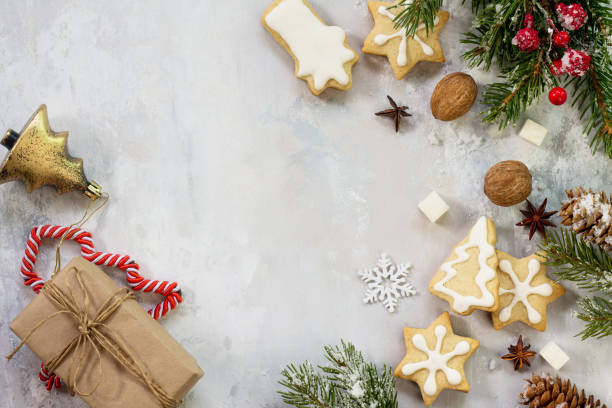 istock Christmas background frame or greeting xmas card. Gingerbread on a festive Christmas table. Flat lay, top view with copy space. 882439794