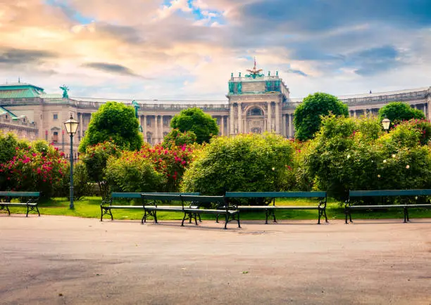 Splendid morning view of  Volksgarten with Hofburg Imperial Palace. Sunny spring cityscape in Vienna, capital of Austria, Europe. Artistic style post processed photo.