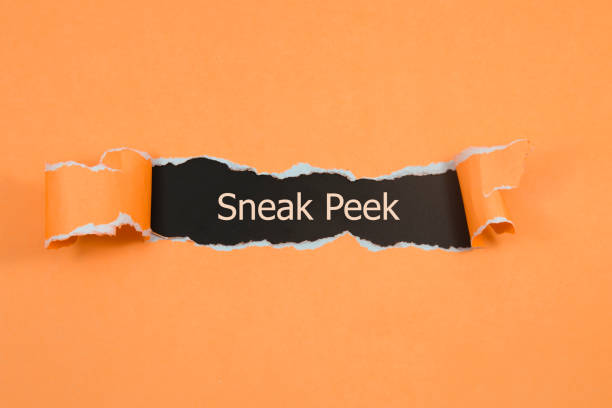 istock The phrase Sneak Peek appearing behind torn paper. 882460556