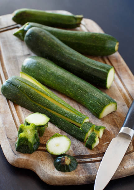 istock Fresh zucchini on wooden board 882461894