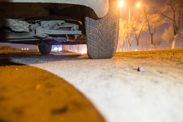 istock car on the road at night 882464114