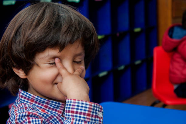 istock Child with fingers in his eyes 882464210