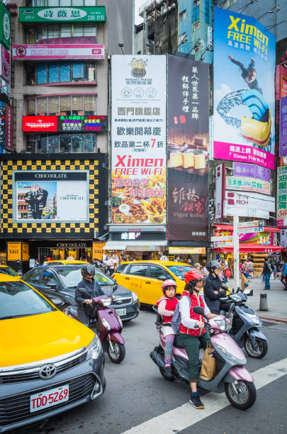 taipei scooters traffic crowded city streets beneath billboards ximending taiwan - child women outdoors mother imagens e fotografias de stock