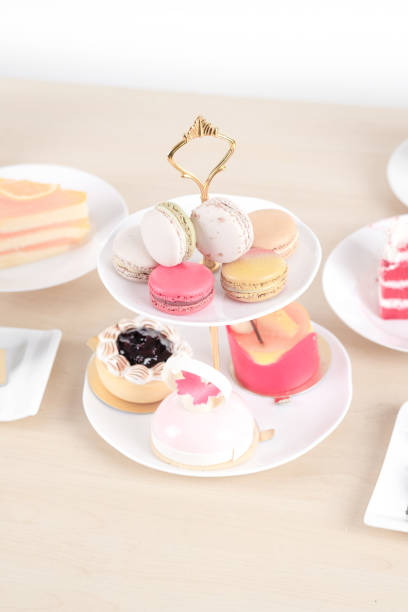 istock Beautiful cake and dessert on wooden table in pastel color - soft focus 882468024