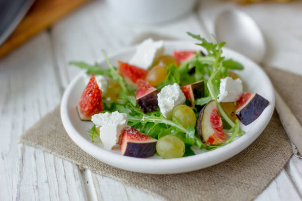 istock Vegetarian salad with figs and goar cheese. 882468052
