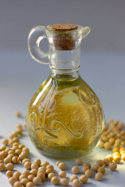 istock Natural soy bean oil with soybeans near it. 882468268