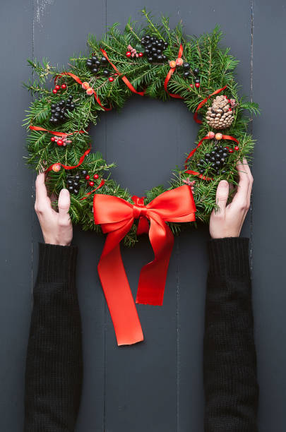 istock Christmas wreath on a wooden background 882468350