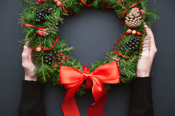 istock Christmas wreath on a wooden background 882468364