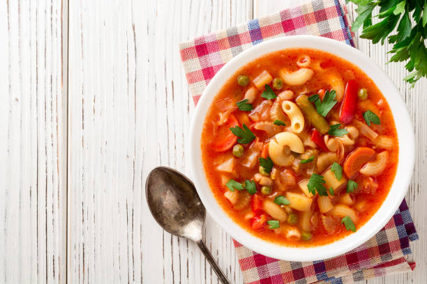 istock Italian minestrone soup on white wooden background. 882468532