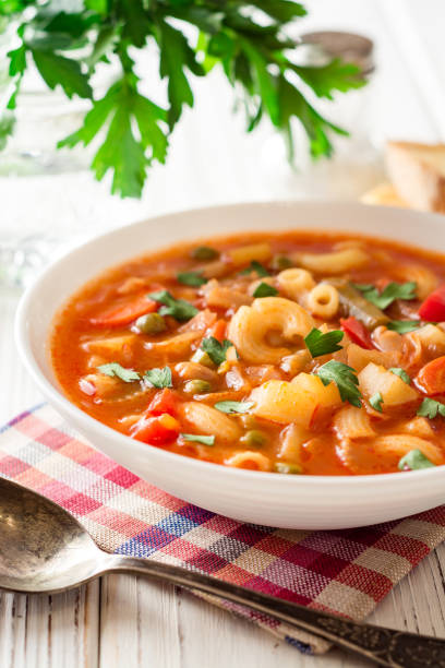 istock Italian minestrone soup on white wooden background. 882470686