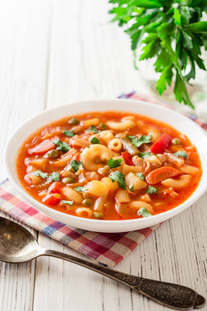 istock Italian minestrone soup on white wooden background. 882470784