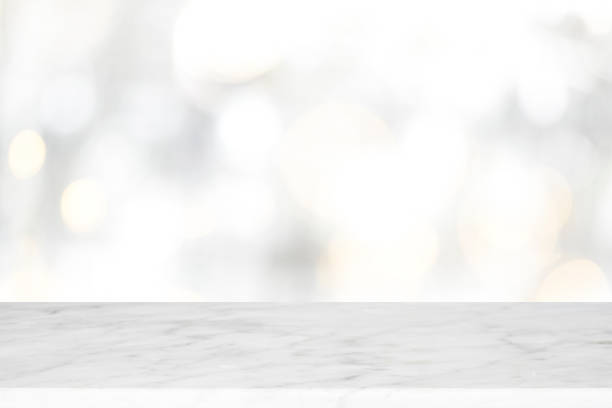 istock Wood table top on white bokeh abstract background 882470816