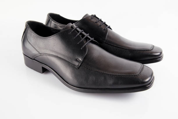 istock Male black leather elegant shoe on white background 882475078