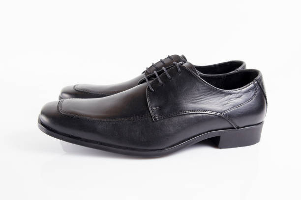 istock Male black leather elegant shoe on white background 882475086