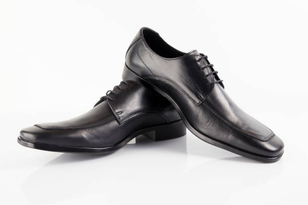 istock Male black leather elegant shoe on white background 882477454