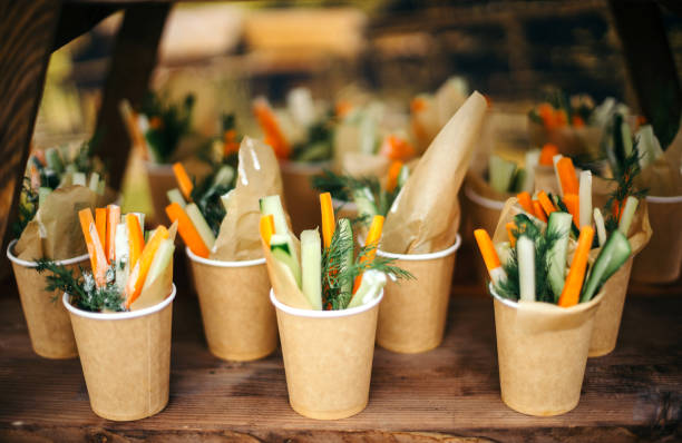 istock Paper cups of assorted vegetable platter - carrots, dill, orange, cucumber 882478200