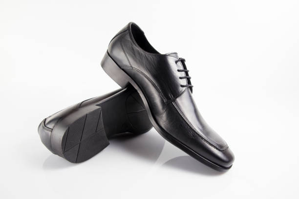 istock Male black leather elegant shoe on white background 882478218