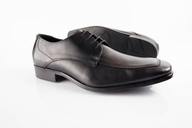 istock Male black leather elegant shoe on white background 882478486