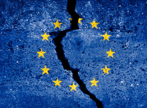 istock Blue european union EU flag on broken wall. EU destruction symbol. 882484230