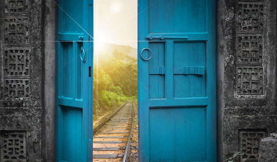 railway tracks behind open old door