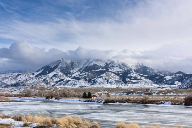 istock Frozen Yellowstone River in Winter Surrounded by Mountains 882484594