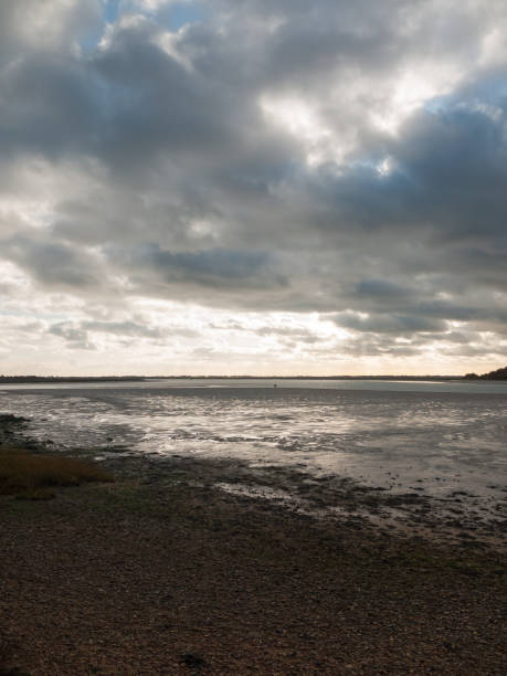 istock stunning dramatic cloud sky over estuary lake river ocean coastline landscape 882487872