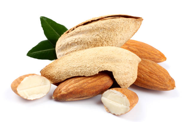 istock almond with green leaf isolated on white background 882490976