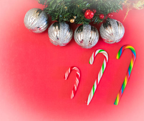 istock Red Christmas background with candy canes and silver ornaments 882494378