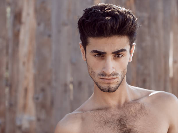 istock Handsome topless young man outdoors 882498560