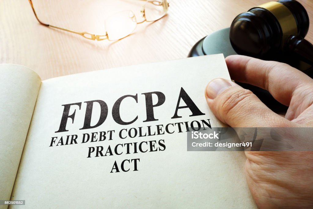 Fair Debt Collection Praktiken Act FDCPA auf einem Tisch. - Lizenzfrei Sammlung Stock-Foto