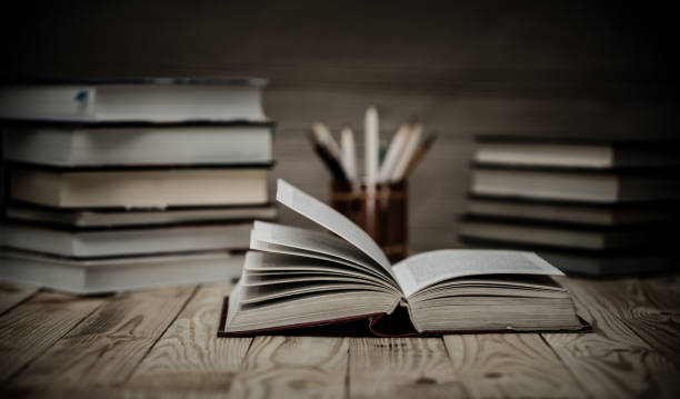 istock Textbooks and books on a wooden table 882502010