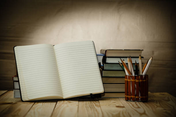 istock Textbooks and books on a wooden table 882502184