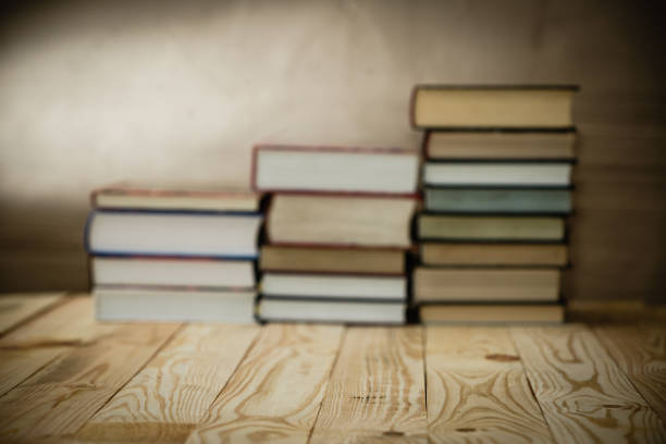 istock Textbooks and books on a wooden table 882502426