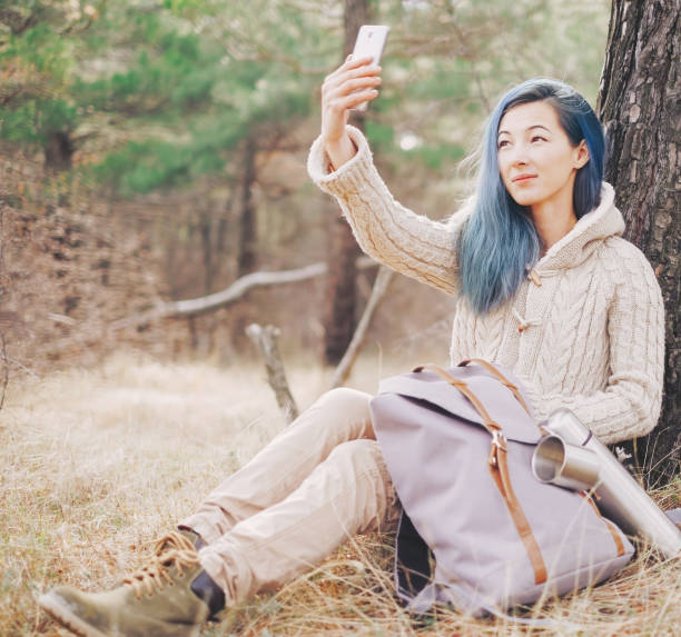 istock Explorer girl taking selfie outdoor. 882513136
