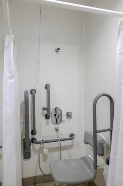 istock Disabled shower area with handrail and seat. 882516280