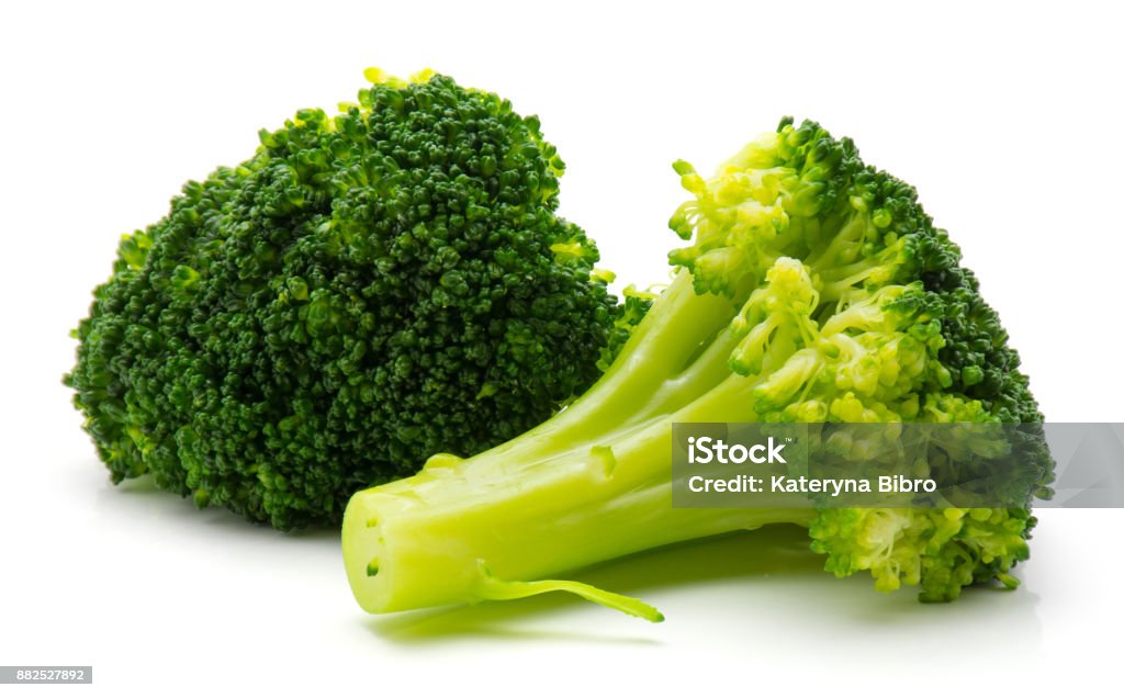 Broccoli isolated on white Steamed broccoli isolated on white background two pieces"n Broccoli Stock Photo