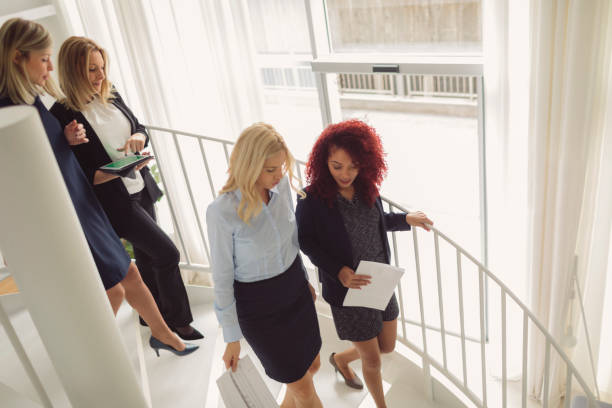istock Women Working Together In The Modern Office 882534960