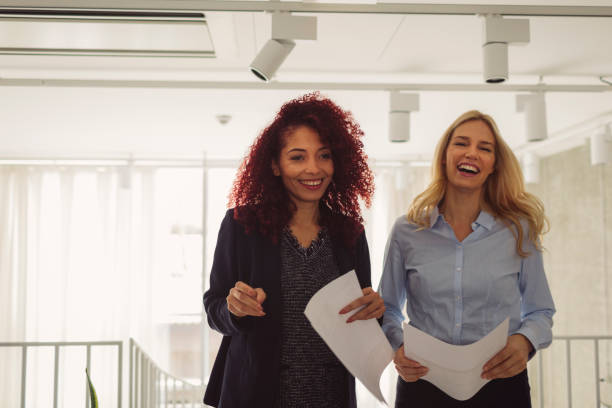 istock Women Working Together In The Modern Office 882535084