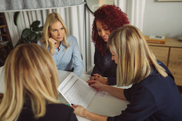 istock Women Working Together In The Modern Office 882535092
