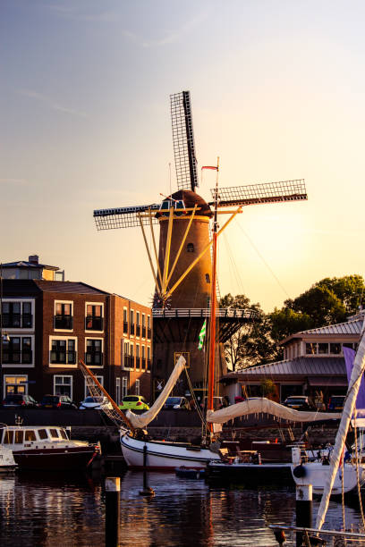 istock Traditional windmill and harbor in the evening light. 882535320