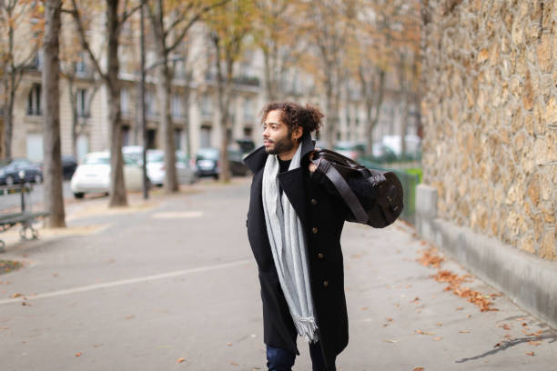 istock Sad man going to railway station and looking at watch 882537886