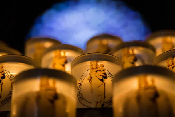 Some tealights inside a pot. Unsharp background.