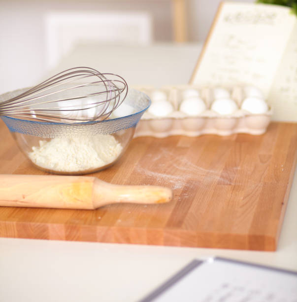 istock Flour with eggs, ricotta cheese and rolling pin at the desk 882558012